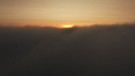 sunrise or sunset above the clouds