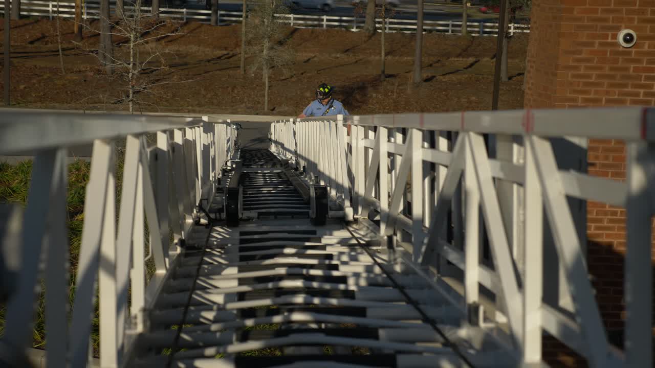 Firefighter tests a ladder on a fire truck during testing for emergency response