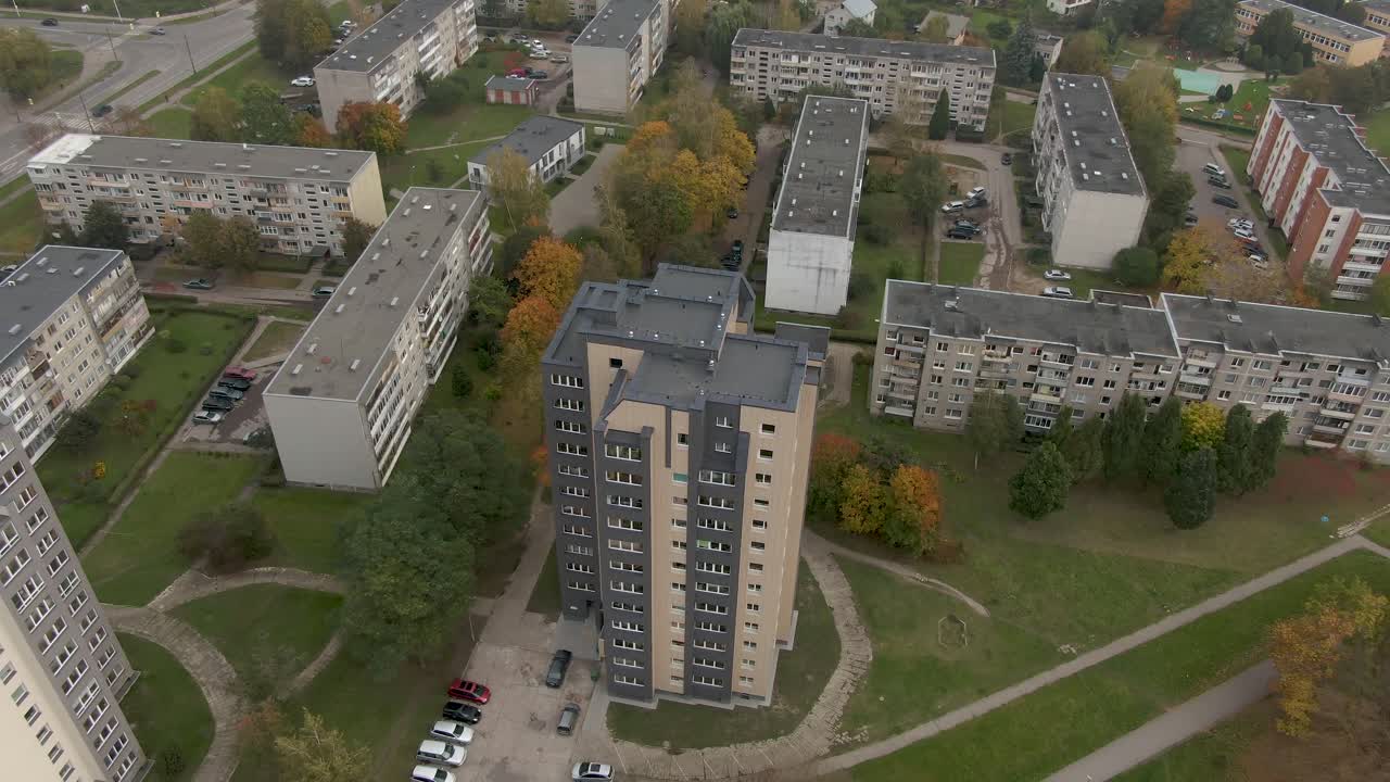 The renovated old residential building built from prefabricated panels in Soviet Union time. Areal view. Kaunas. Lithunania. Summer, day