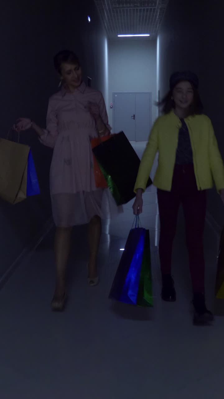 Two Women and a Girl Shopping in a Mall