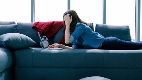 beautiful smart asian woman relax time with laptop shop online in living room house background