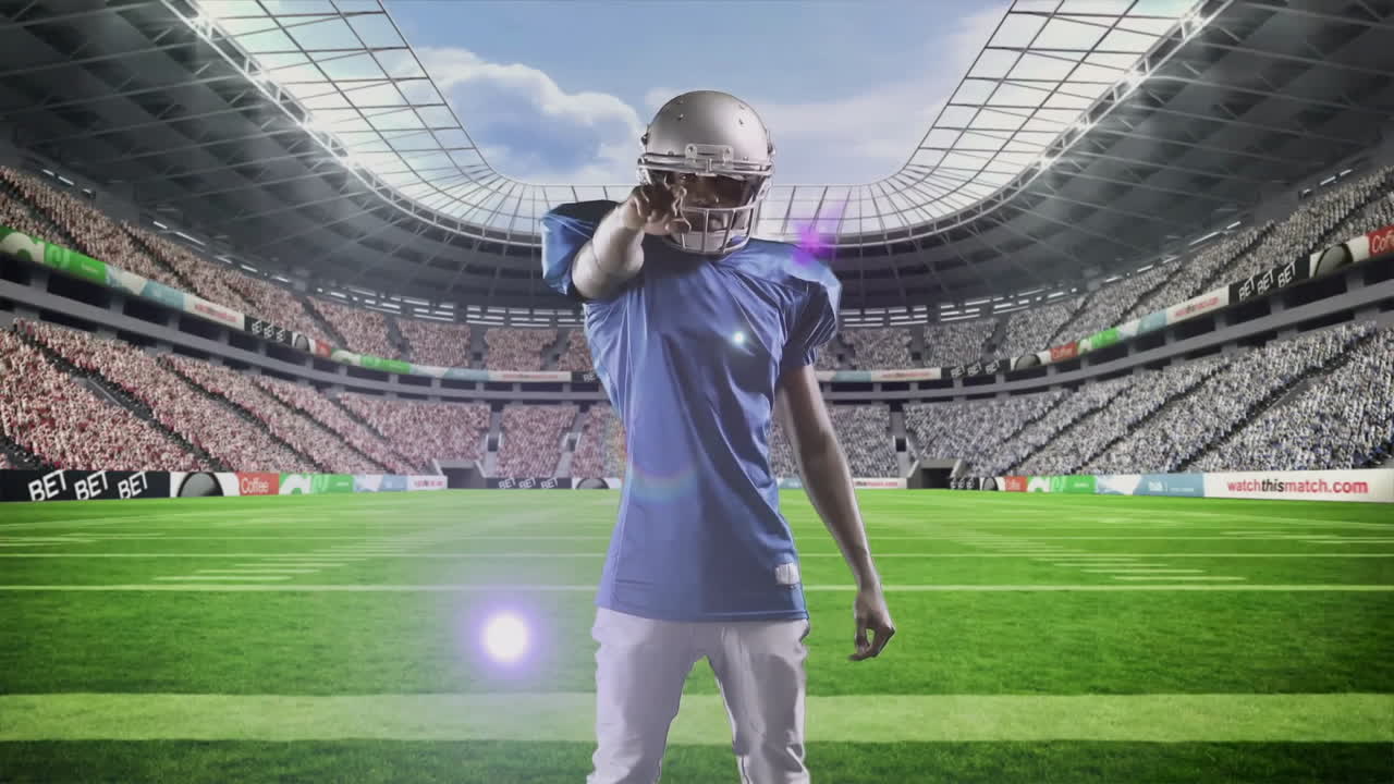 Pointing on stadium field, American football player in blue jersey in action
