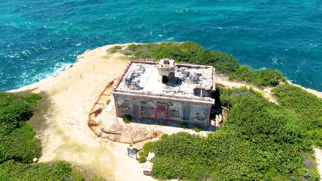 Aerial View of Abandoned Lighthouse Ruins on a Coastal Cliff