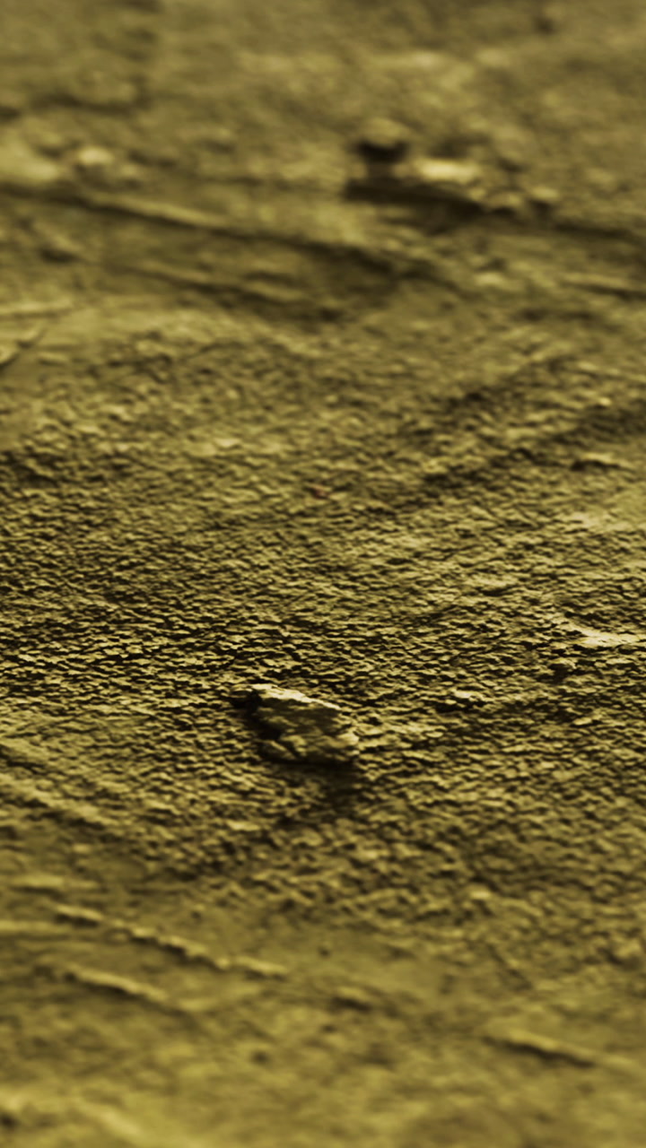 Texture of yellowish surface with grooves and patterns in natural light