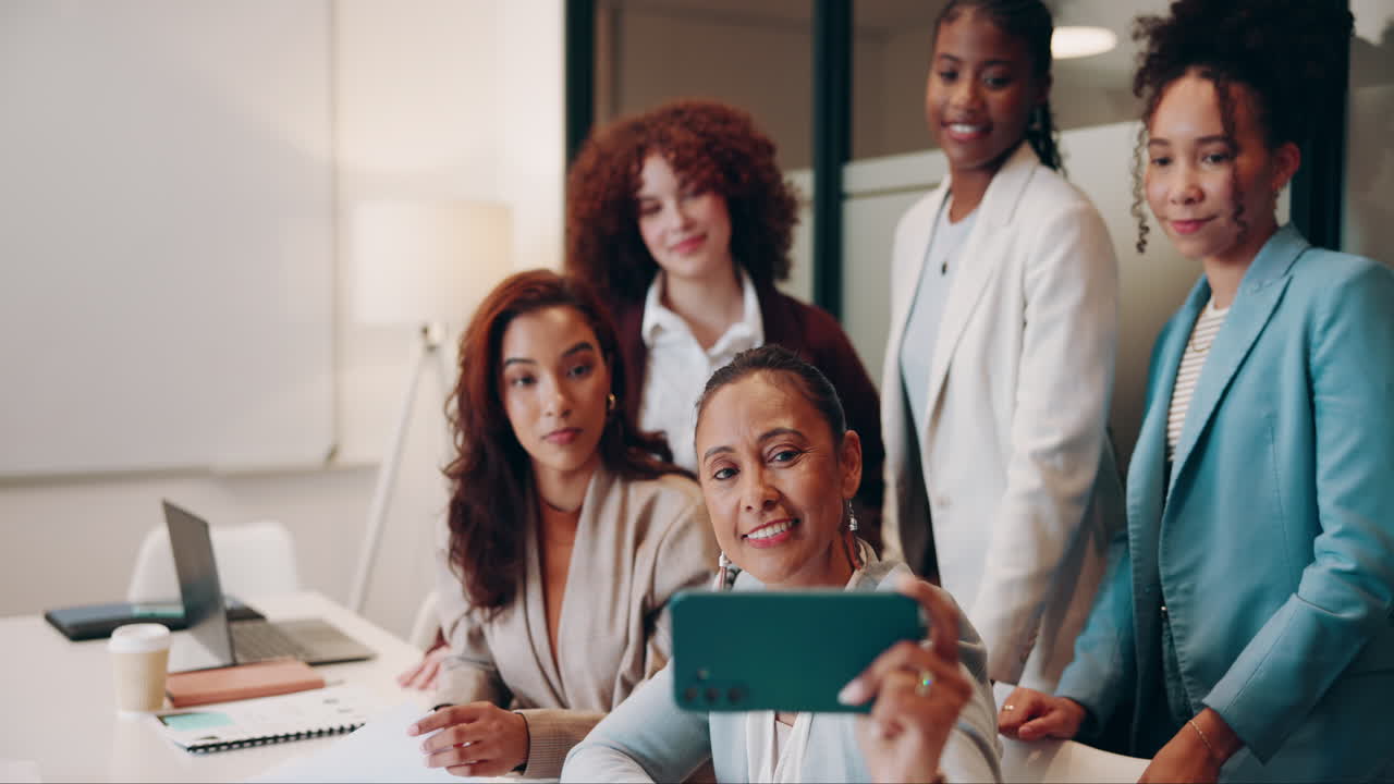Five Businesswomen Taking A Selfie Together In An Office