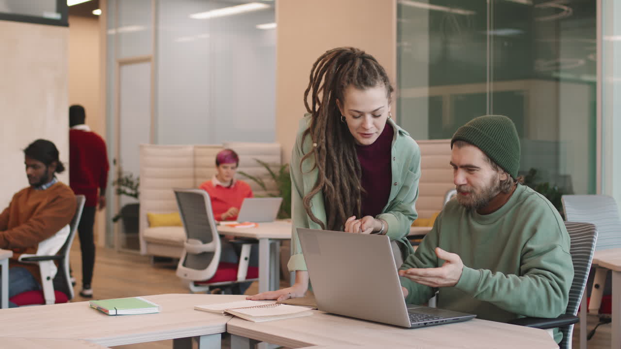 Slowmo of Young Businesspeople in Open-Plan Office