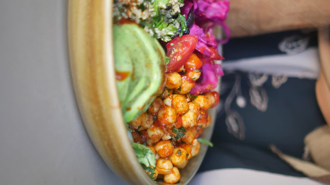 Close-up of a healthy food bowl with avocado and chickpeas