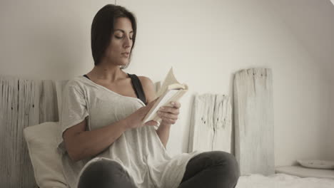 young woman reads a book