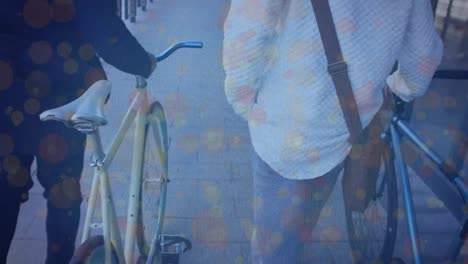 animación de formas que se mueven sobre hombres de negocios biraciales caminando con bicicletas