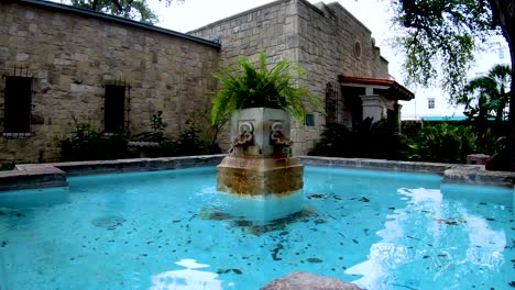 fountains around the courtyard add the sound of running water to the peaceful gardens of the alamo complex.  4k30fps