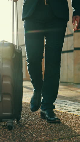 Feet,-business-man-and-suitcase-in-street