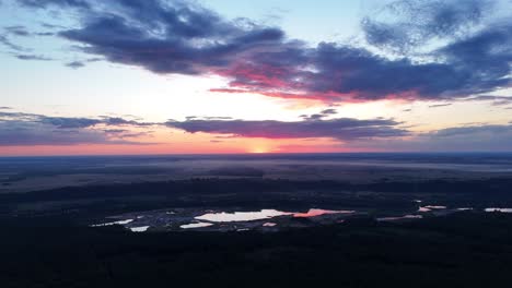 stunning aerial view of sunset over lakes and forest
