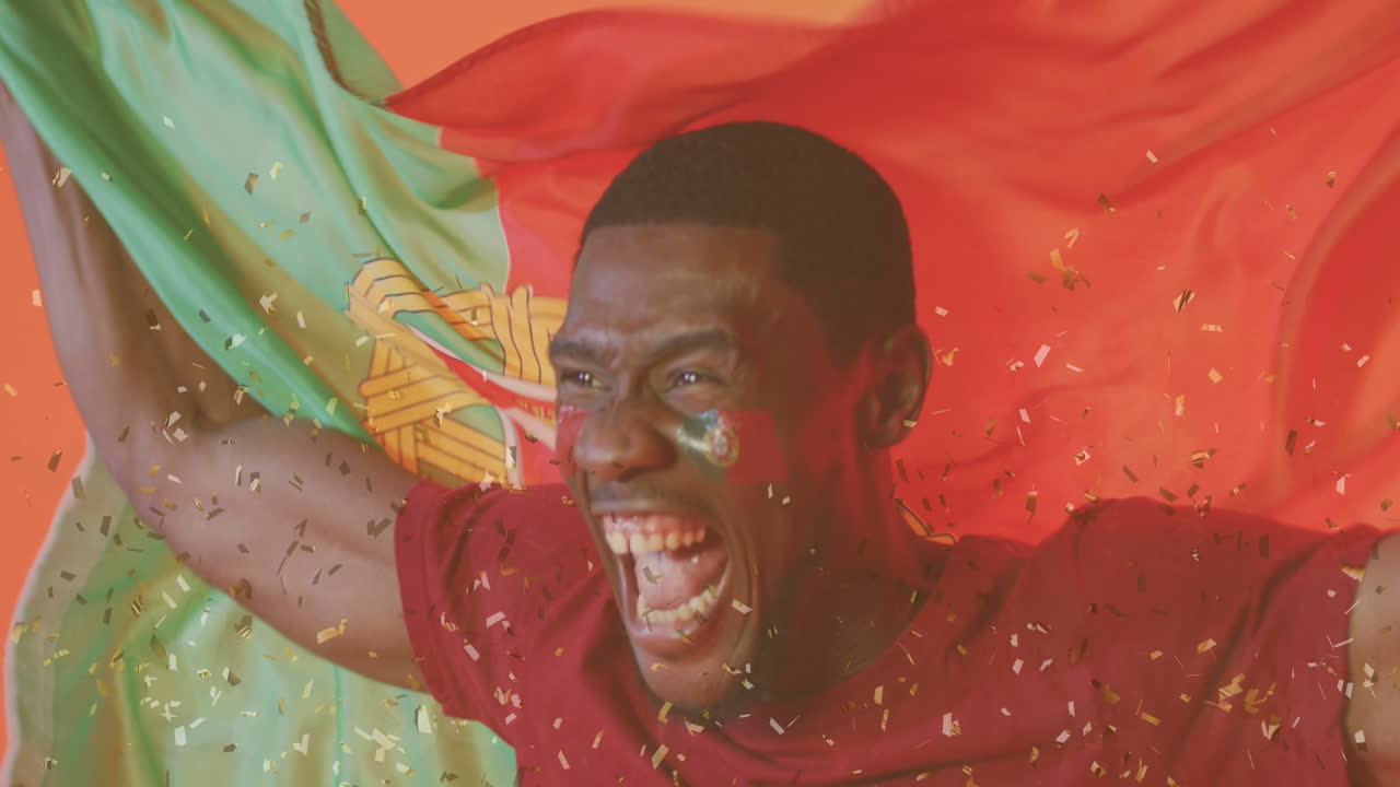 animación de confeti cayendo sobre futbolista afroamericano celebrando con la bandera de portugal