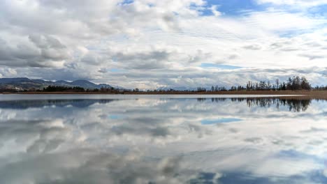 clouds move over the lake