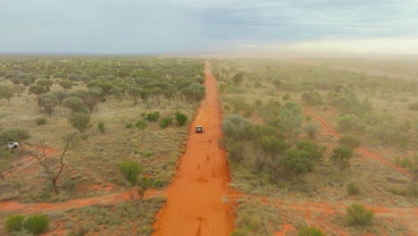 Desert-Buggy-Speeding-Along-Red-Dirt-Track-In-Australian-Outback,-Finke-Desert-Race-4K-Drone