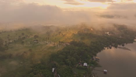 panoramic view of rio dulce during foggy sunrise, aerial