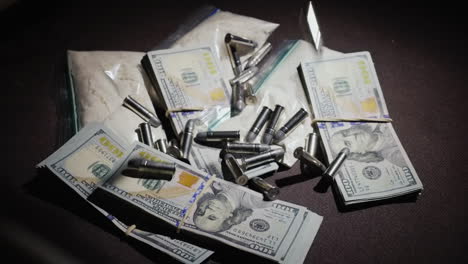 bullets fall on money and drug bags