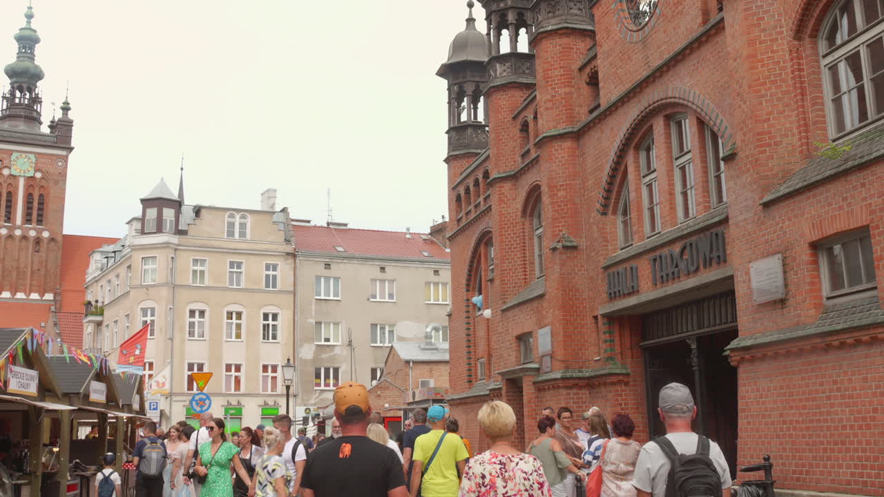 Shot of visitors, tourists or locals walking on pederstrian street of old town of Gdansk, Poland.