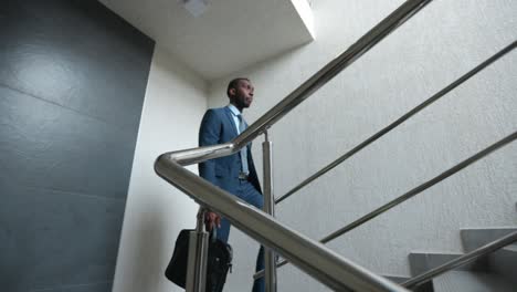 businessman walking up stairs