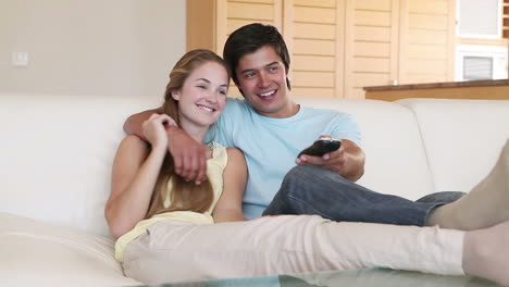 a couple watching television together