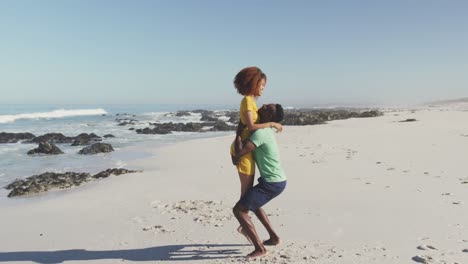 african american couple enjoying seaside