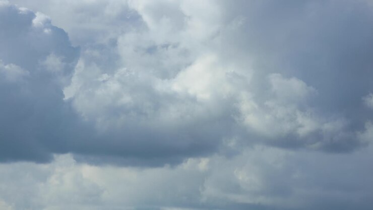 Intrinsic play of cumulus rain clouds forming, disappearing and stumbling over one and other in cinematic closeup detail texture view