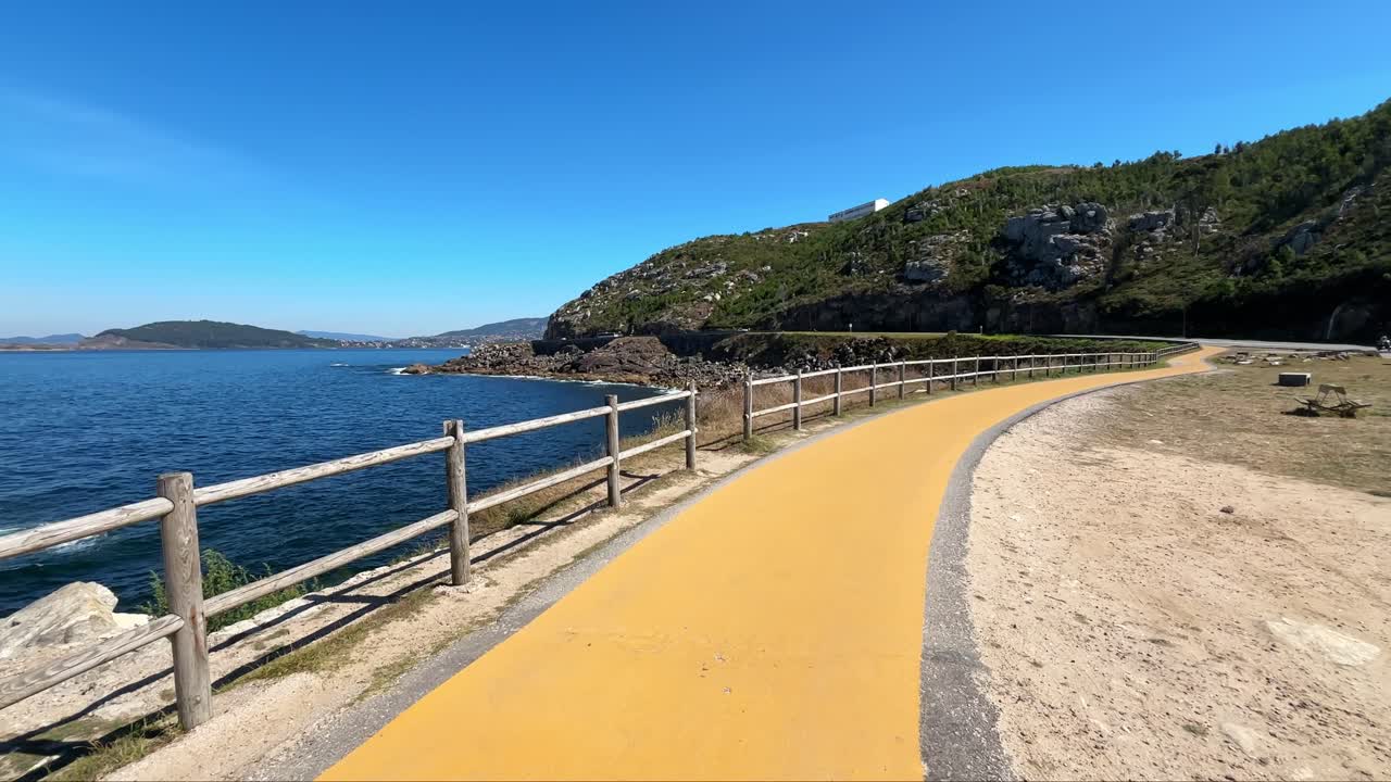 Yellow Road Leading Alongside North Atlantic Ocean near the Shores of Spain