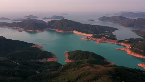 high island reservoir east dam in sai kung hong kong global geopark ,is a rare volcanic hexagonal rock columns, beautiful scenery, hiking trails, beaches and islands, geological formations, sea bay