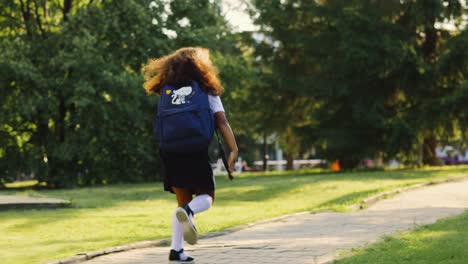 schoolgirl running in park