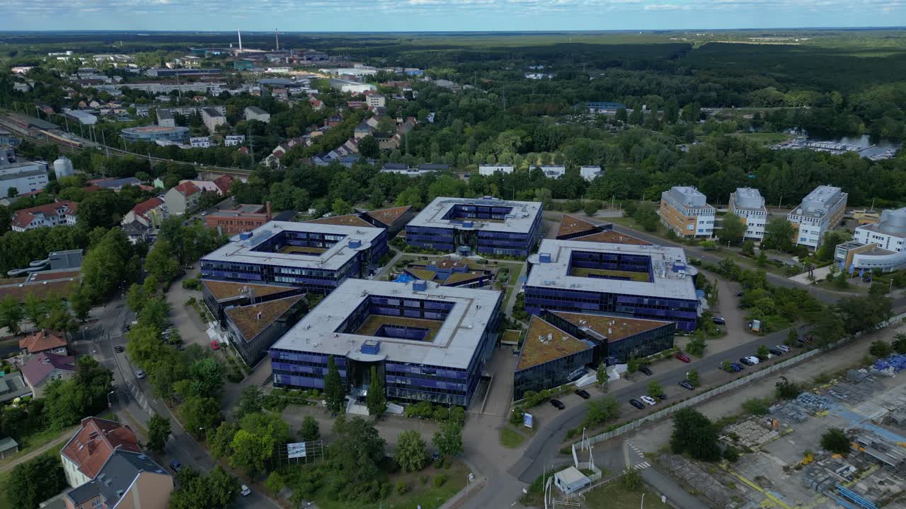 Hennigsdorf, Germany, showcasing residential areas, railway infrastructure and commercial buildings. Best aerial view flight drone shot from above