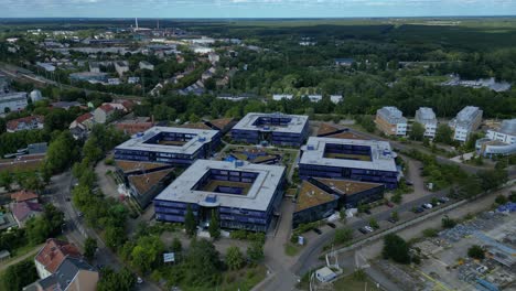 Hennigsdorf, Germany, showcasing residential areas, railway infrastructure and commercial buildings. Best aerial view flight drone shot from above