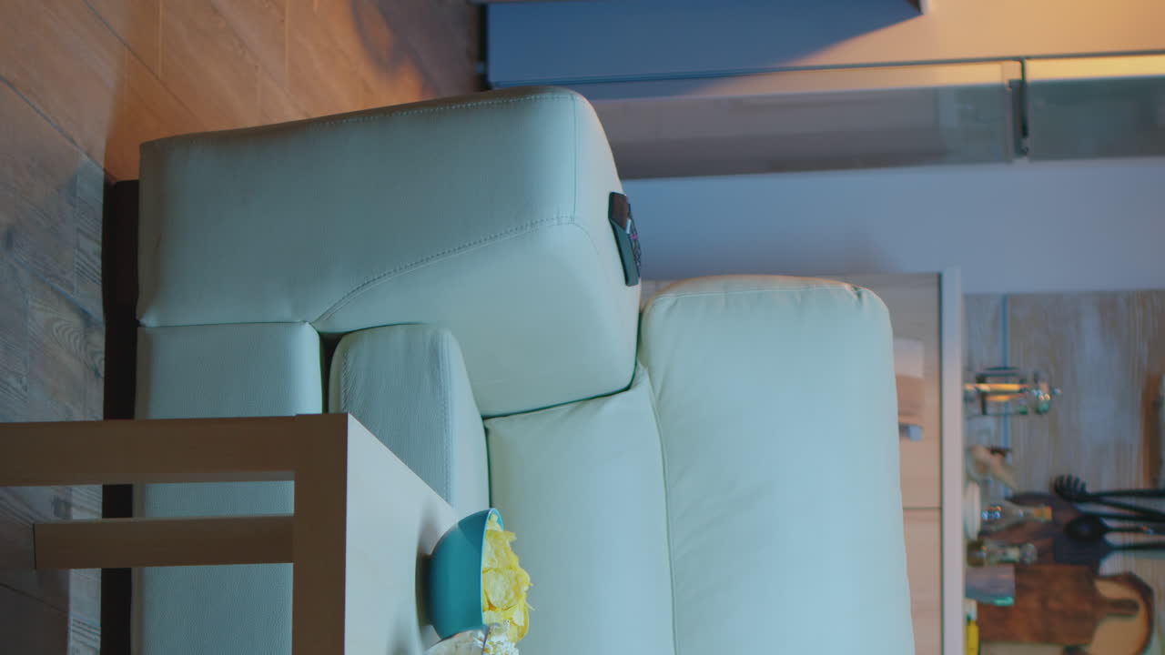 Vertical Video: Housewife Changing Tv Channels