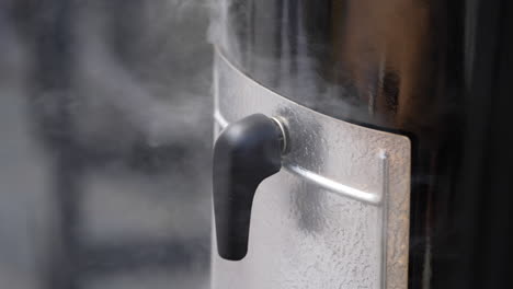 smoke coming out of the meat smoker equipment