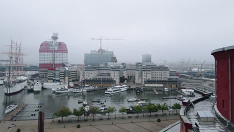 view of the barque viking and lilla bommen building from gothenburg opera house in gothenburg, sweden - approaching drone shot