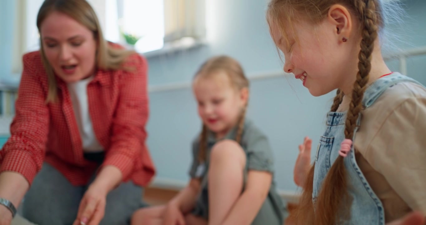 Happy Young Girl Reveals Face and Smiles During Playtime
