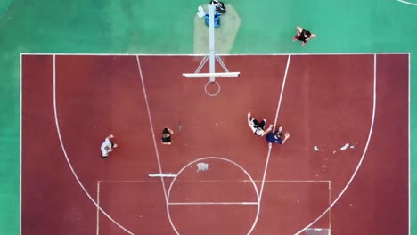 men playing basketball seen from the drone