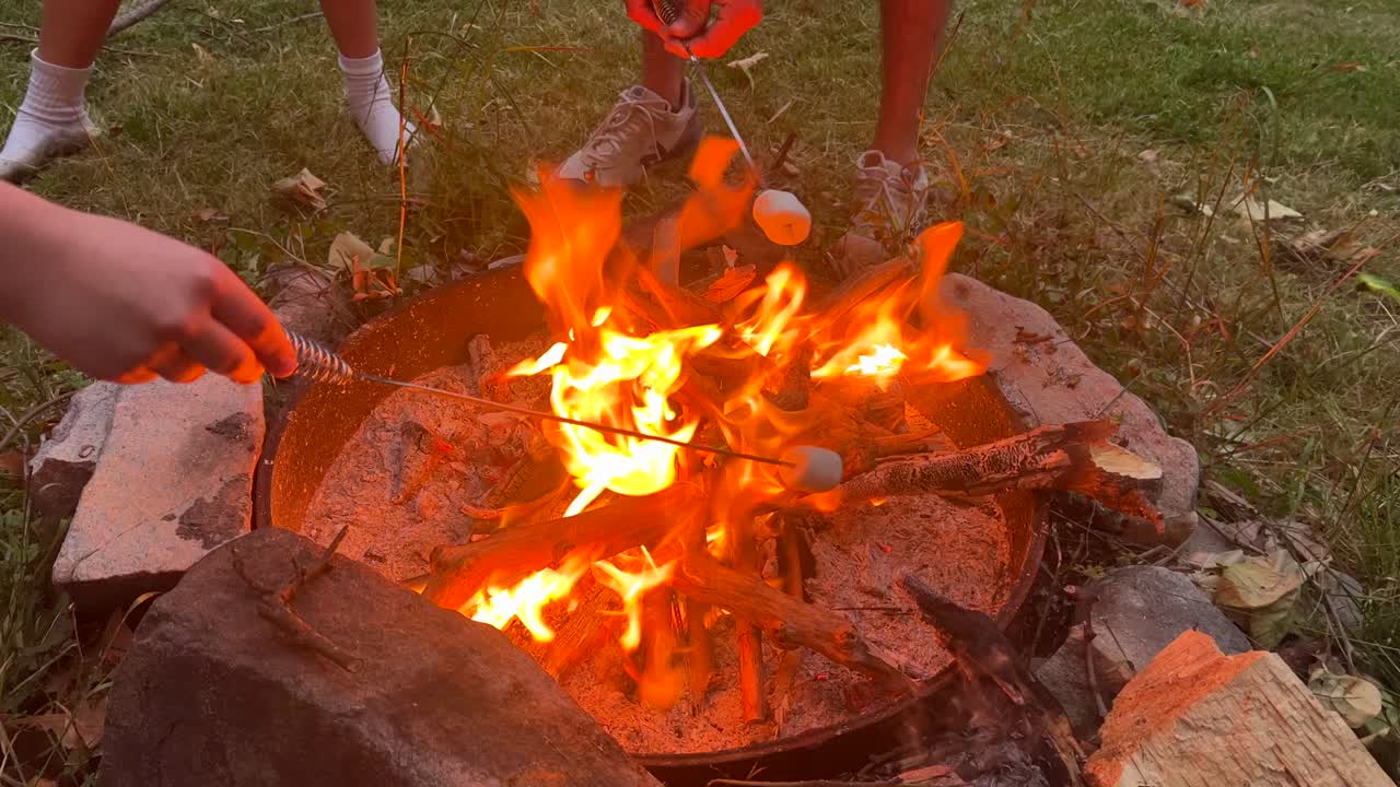 Roasting marshmallows over fire for smores.