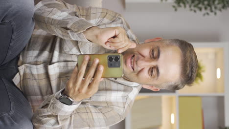 Vertical-video-of-Man-looking-at-camera-with-shopping-bags.