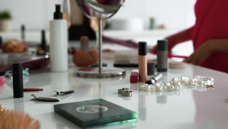 kitchen table with accessories and makeup elements