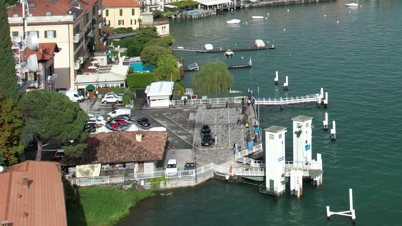 Scenic aerial view of lakeside activity in the Italian Alps region