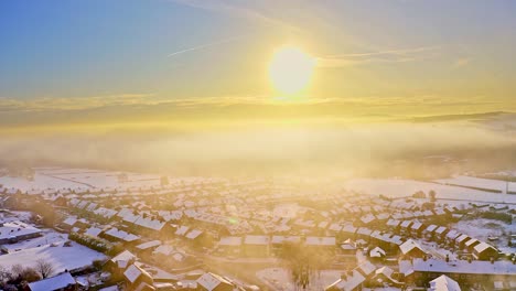 aerial winter sunset snow covered rooftops of hemingfield, barnsley