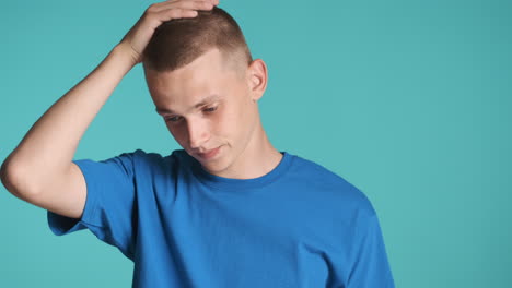 worried man in blue t-shirt