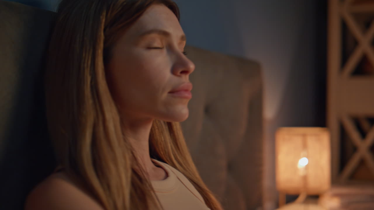 Woman closing laptop bedtime feeling tired closeup. Girl ending online work