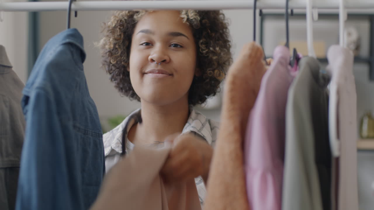 Woman choosing clothes in a wardrobe