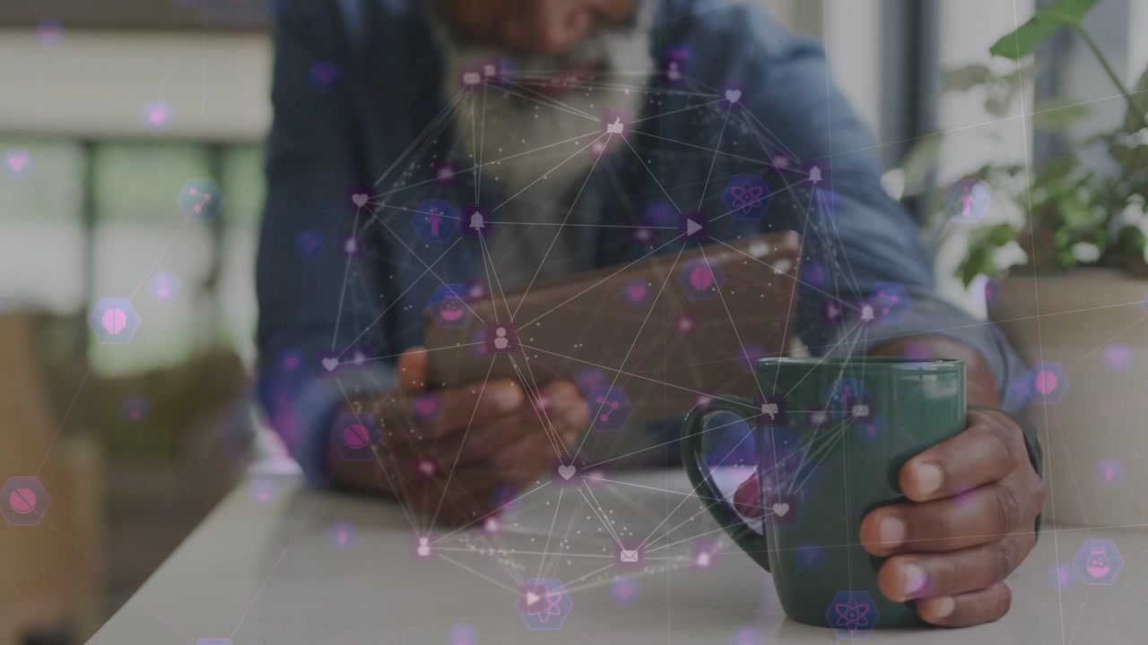 Senior man tapping tablet, activating purple tech overlay, reaching and lifting mug to sip