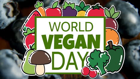 animation of world vegan day text banner and vegetable icons against close up of blue berries