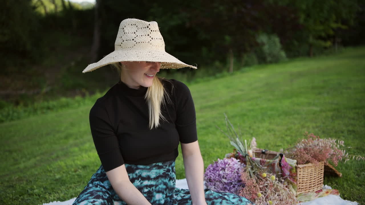 A medium shot of a beautiful woman putting her face mask on