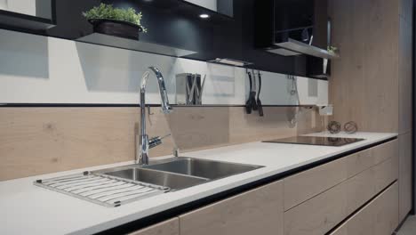 a wood kitchen showroom gimbal shot bench and faucet