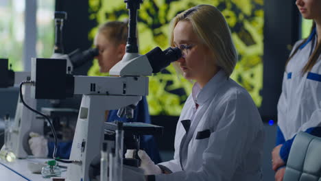 scientists using microscopes in a laboratory