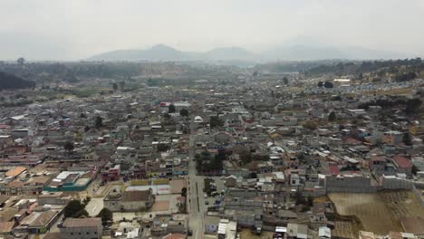 Aerial-flyover-of-quiet-mountain-streets-of-Salcaja-city-in-Guatemala